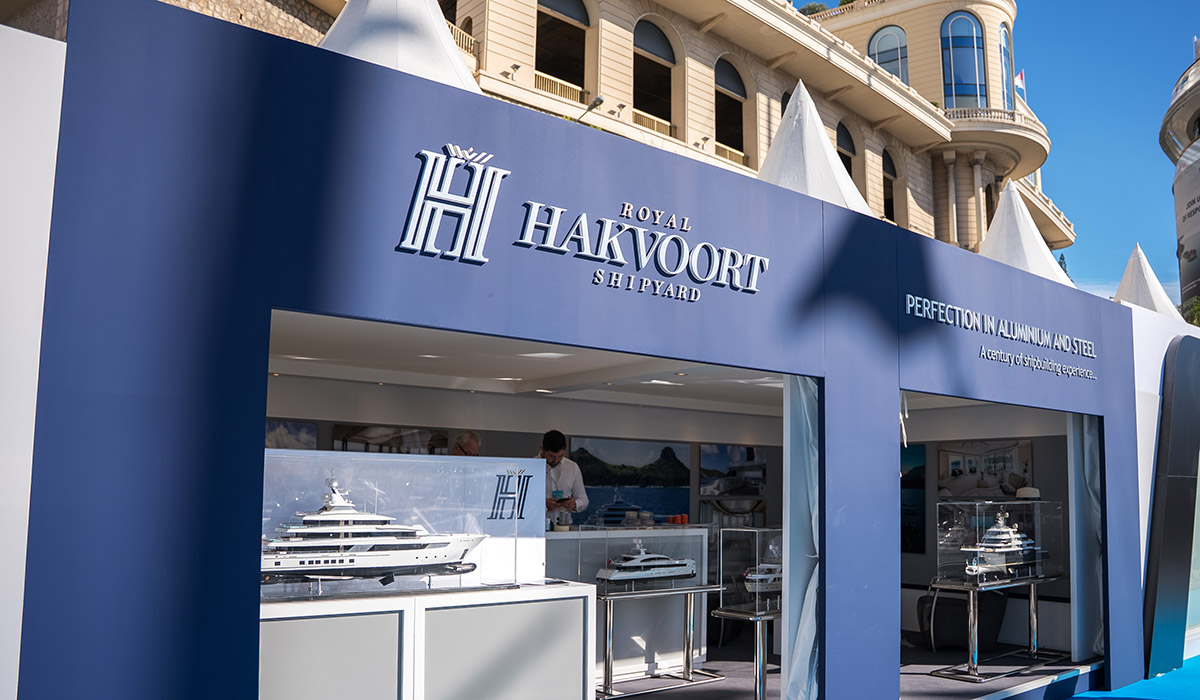 Entrance detail photo of Royal Hakvoort Shipyard exhibition stand at Monaco Yacht Show 2025