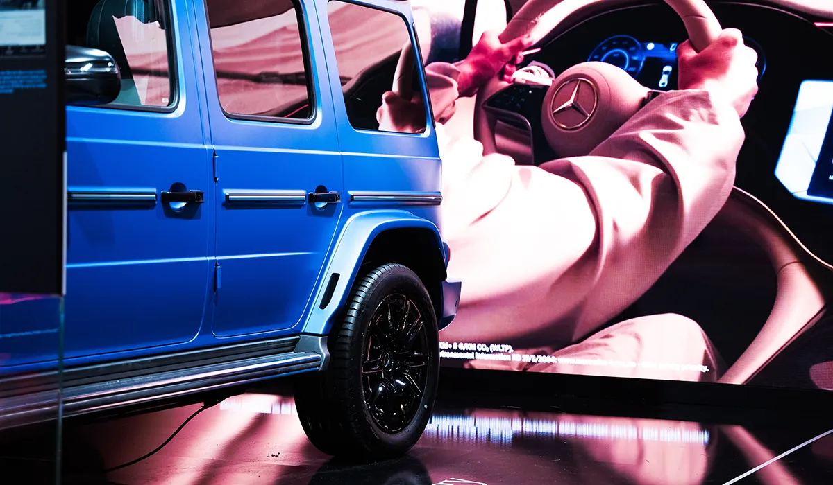 Close-up detail of the product presentation area of the exhibition stand for Mercedes-Benz at the Brussels Motor Show 2025, created by Hypsos