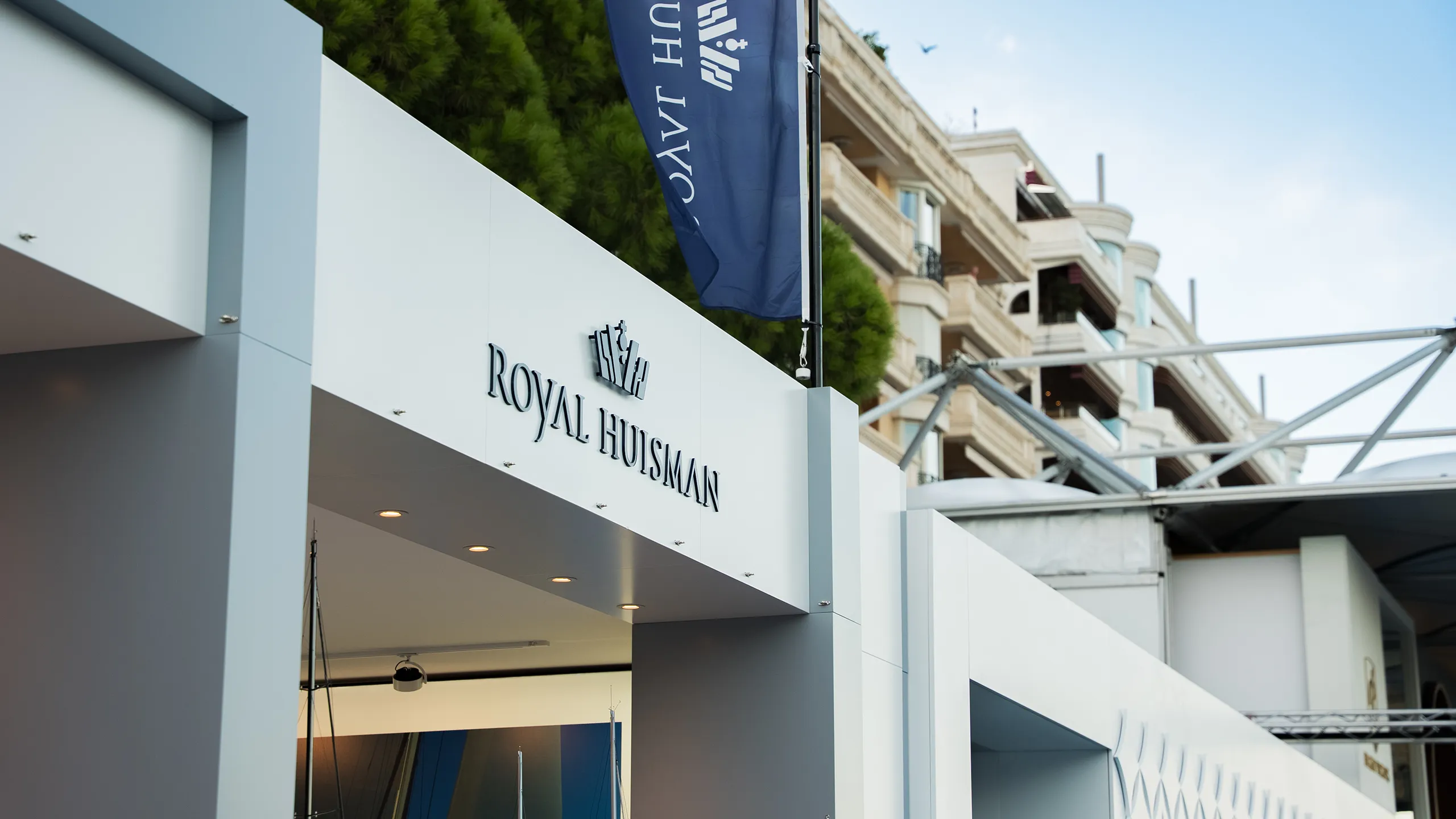 Close-up of the entrance area of the Hypsos exhibition stand for Royal Huisman at the Monaco Yacht Show 2025